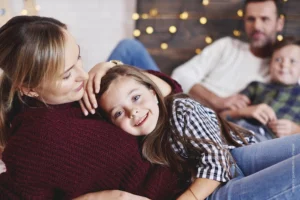 beautiful family spending time together in the house with the GlowStone Lights installed